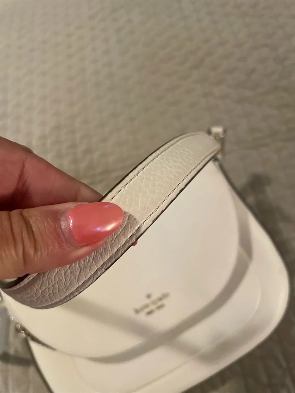 kate spade cream pebbled leather crossbody with gold logo
